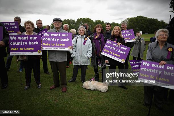 Vote Leave supporters listen to UKIP leader Nigel Farage as he campaigns for votes to leave the European Union on May 25, 2016 near Sheffield,...