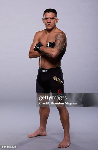 Lightweight champion Rafael dos Anjos poses for a portrait during a UFC photo session on January 19, 2016 in Las Vegas, Nevada.