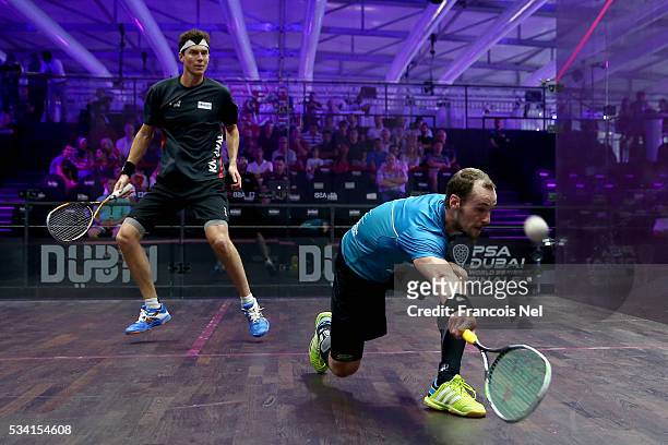 Gregory Gaultier of France competes against Cameron Pilley of Australia during day two of the PSA Dubai World Series Finals 2016 at Burj Park on May...
