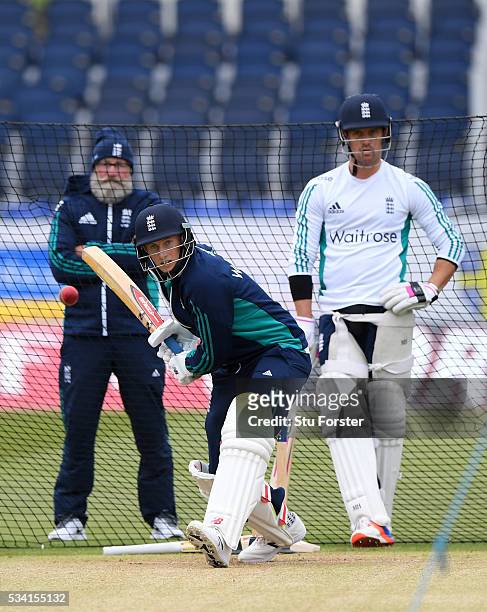 England batsman Joe Root faces whilst team mate Nick Compton and former England batsman Graeme Fowler look on during England Nets session ahead of...