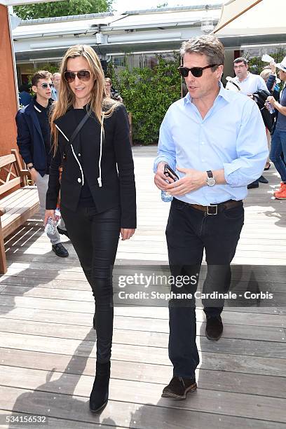 Anna Elisabet Eberstein and Hugh Grant attend the 2016 French tennis Open day Four at Roland Garros on May 25, 2016 in Paris, France.