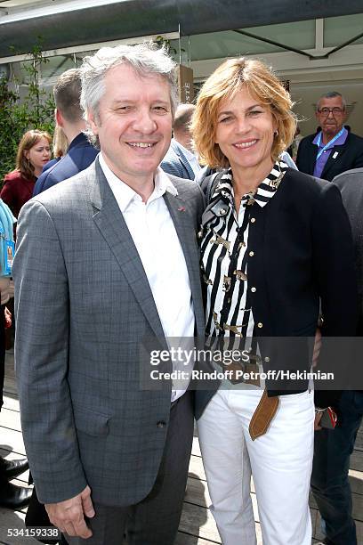 Thierry Rey and Virginie Couperie-Eiffel attend the 2016 French Tennis Open - Day Four at Roland Garros on May 25, 2016 in Paris, France.