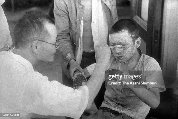 An a-bomb exposed boy receives medical treatment at the Hiroshima Red Cross hospital on Augusut 10, 1945 in Hiroshima, Japan. The world's first...