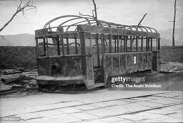 Burned tram by the atomic bomb remains on the street 70m east from Kamiyacho crossing in August, 1945 in Hiroshima, Japan. The world's first atomic...