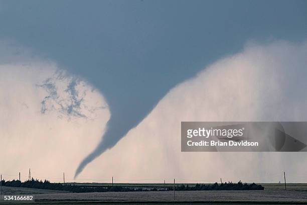 Tornado is seen south of Dodge City, Kansas moving north on May 24, 2016 in Dodge City, Kansas. About 30 tornadoes were reported on Tuesday in five...