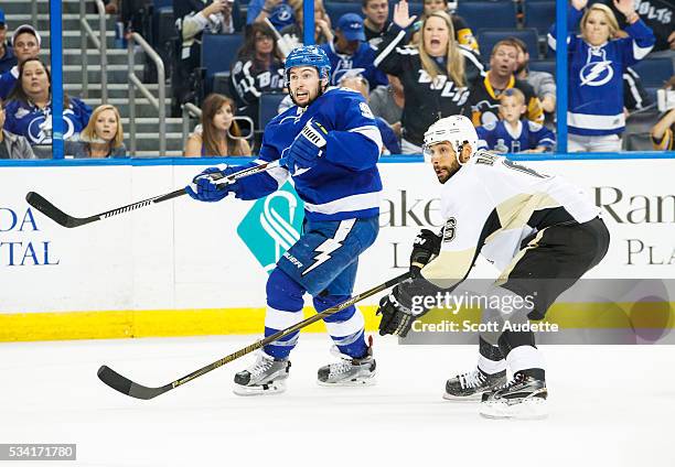 Tyler Johnson of the Tampa Bay Lightning skates against Trevor Daley of the Pittsburgh Penguins during the third period of Game Three of the Eastern...