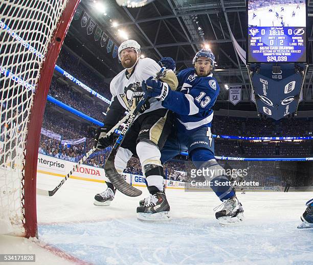 Cedric Paquette of the Tampa Bay Lightning skates against Phil Kessel of the Pittsburgh Penguins during the first period of Game Three of the Eastern...