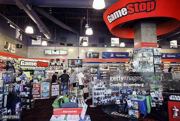 Customers shop for video games at a GameStop Corp. Store in West Hollywood, California, U.S., on Sunday, May 22, 2016. GameStop Corp. Is scheduled to...