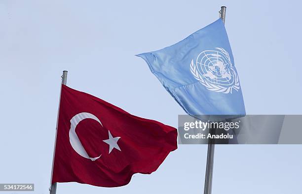 Flags of the United Nations and Turkey wave outside the Titanic Hotel where Midterm Review of the Istanbul Programme of Action, during the flag...