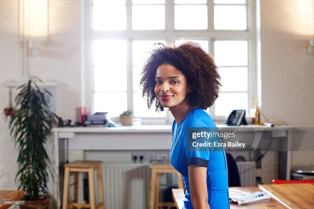 Portrait of a creative woman in loft apartment.