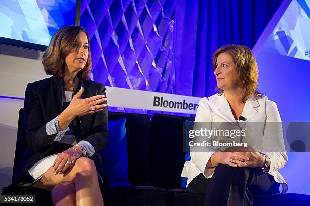 Donna Morris, senior vice president of customer and employee experience at Adobe Systems Inc., left, speaks as Jana Rich, founder and chief executive...