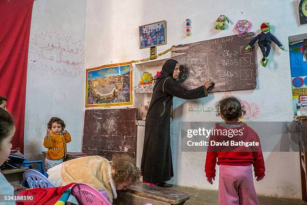 Koran classroom setting for younger children in the old city of Fes, Morocco.