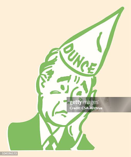 trauriger mann in eselsmütze - dunce cap stock-grafiken, -clipart, -cartoons und -symbole