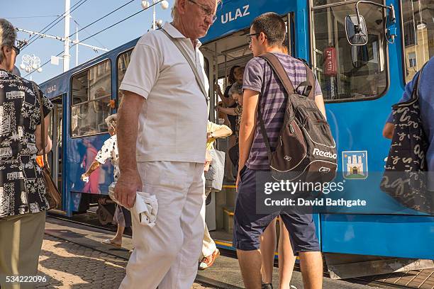 Passengers young and old use the new, modern street trams of Croatia's capital city, Zagreb.