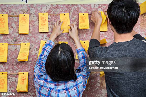 hanging up the wishes - tainan stock pictures, royalty-free photos & images