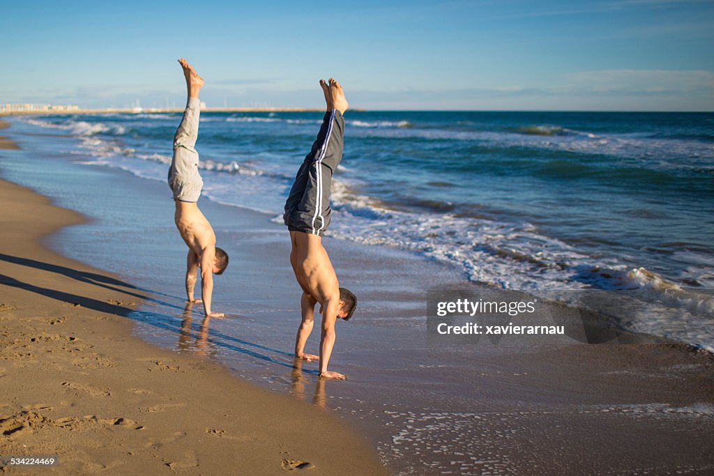 Handstand hold street workout at the beach