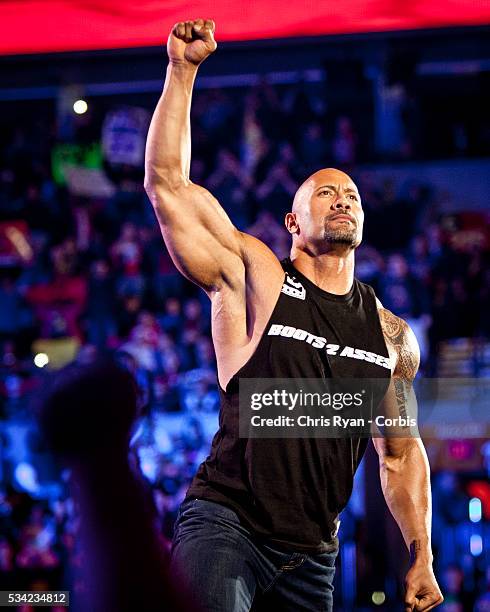 Dwayne Johnson, aka The Rock, enters the ring to talk smack about his upcoming opponent John Cena during the WWE Raw event at Rose Garden arena in...