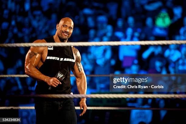 Dwayne Johnson, aka The Rock, enters the ring to talk smack about his upcoming opponent John Cena during the WWE Raw event at Rose Garden arena in...