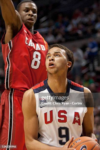 Andrew Wiggins goes up to block a shot attempt by Kyle Anderson during the 2012 Nike Hoop Summit at Rose Garden arena in Portland, Oregon, Saturday...