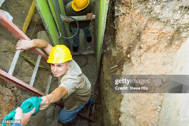 building contractors working underground - trench safety stock pictures, royalty-free photos & images