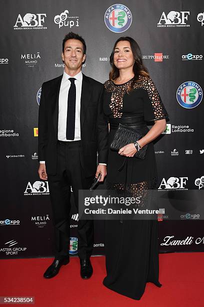 Alena Seredova and Alessandro Nasi walk the red carpet of Bocelli and Zanetti Night on May 25, 2016 in Rho, Italy.