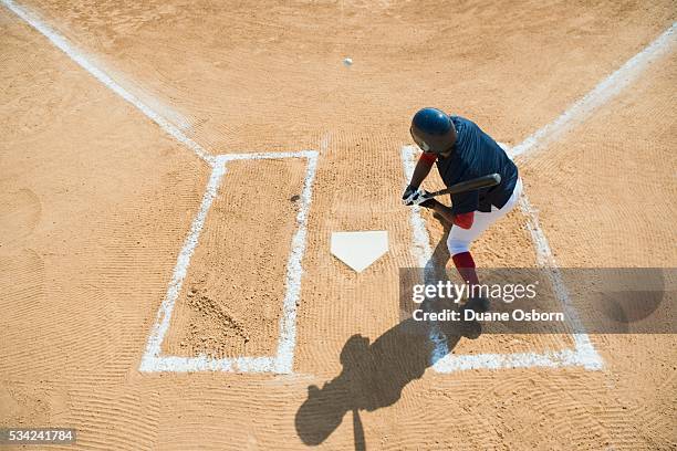 batter preparing to hit baseball - baseball behind home plate stock pictures, royalty-free photos & images
