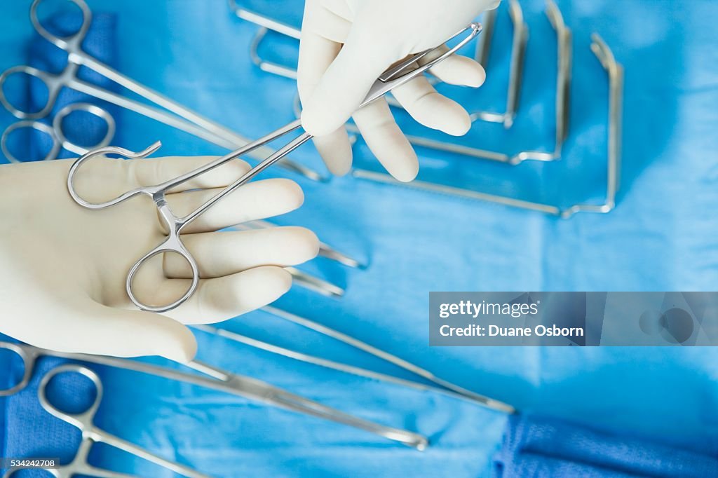 Surgeons with a Surgical Instrument