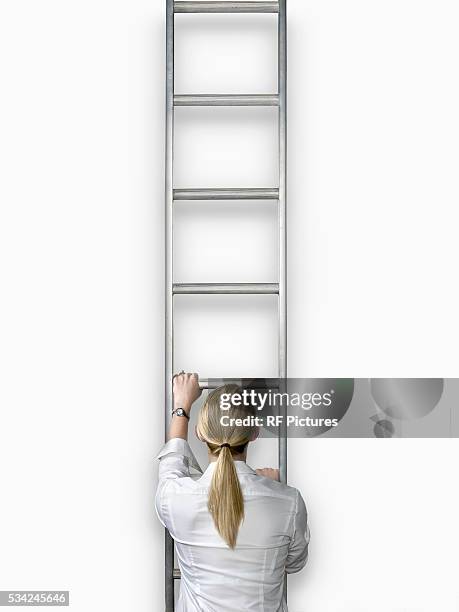 woman climbing ladder, back view - metallic blouse stock pictures, royalty-free photos & images