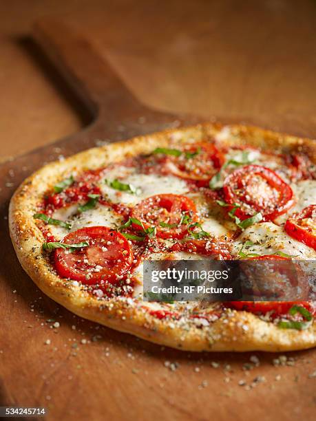 fresh pizza ready to eat - pizza stock pictures, royalty-free photos & images