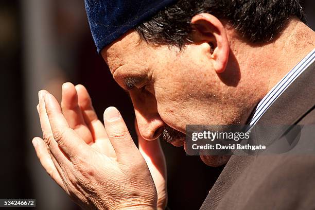 Muslim man prays in the courtyard at Eyup Mosque.