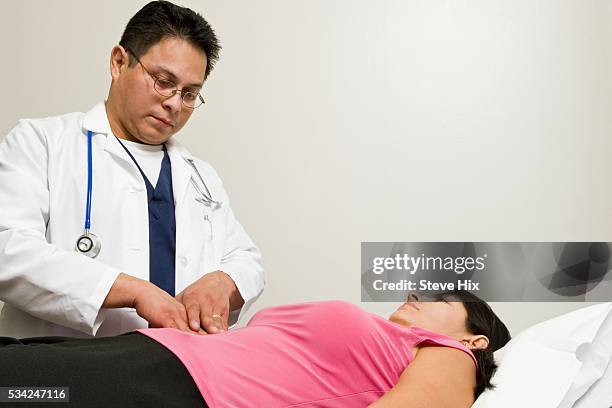 doctor examining patient - sleeveless undershirt stock pictures, royalty-free photos & images