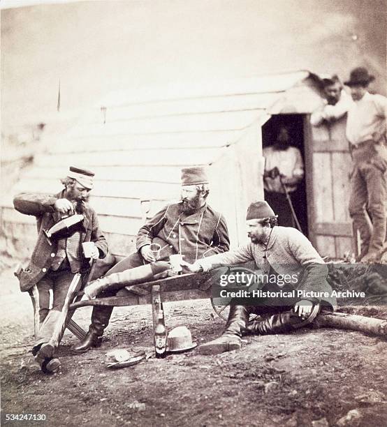 French and British soldiers spend time together outside Sevatapol during the Crimean War. | Location: Near Sevastapol, Russia.