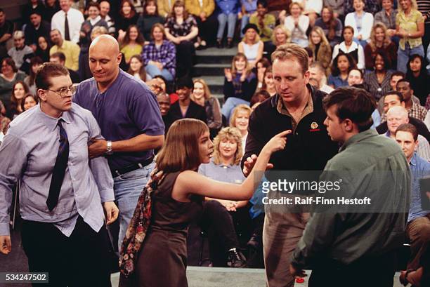 Security guard Steve Wilkos and another guard separate and restrain fighting guests on The Jerry Springer Show. The show's topic was "I Am Pregnant...
