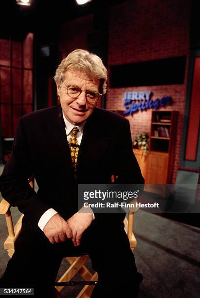 Talk show host Jerry Springer sits on the set of his TV program The Jerry Springer Show. The show is known for its sensational topics and the fights...