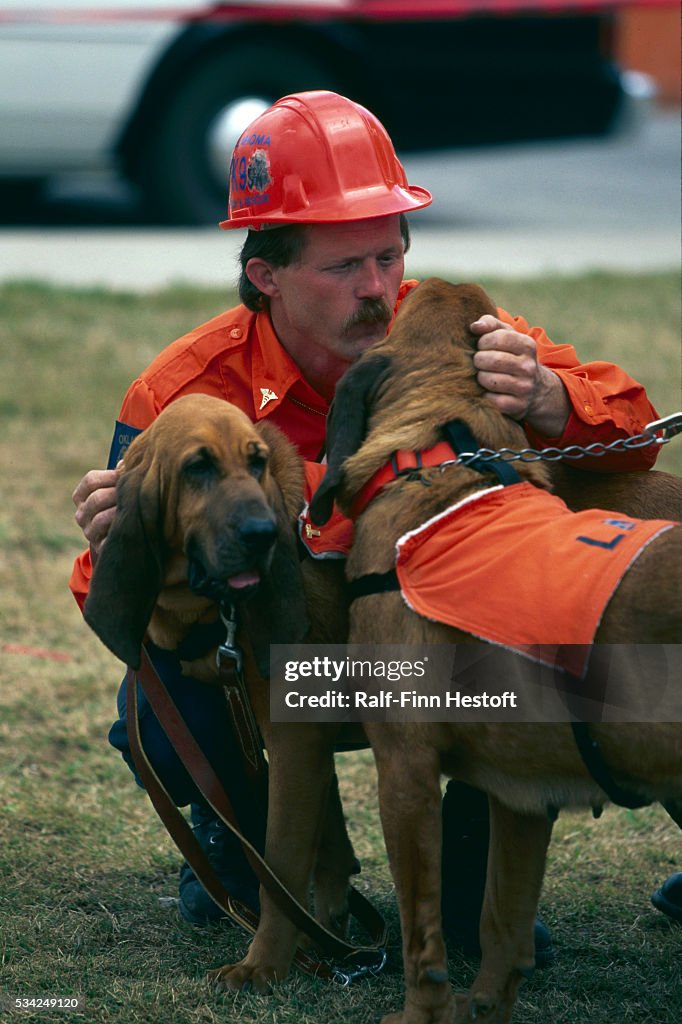Rescue Worker with Scent Tracking Dogs