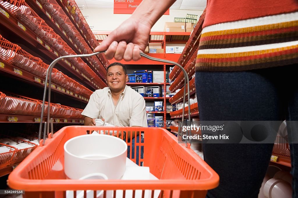 Customers in Hardware Store Aisle