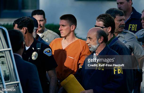 Agents and police officers escort Oklahoma City bombing suspect Timothy McVeigh from the Noble County Courthouse. On April 19th a fuel-and-fertilizer...