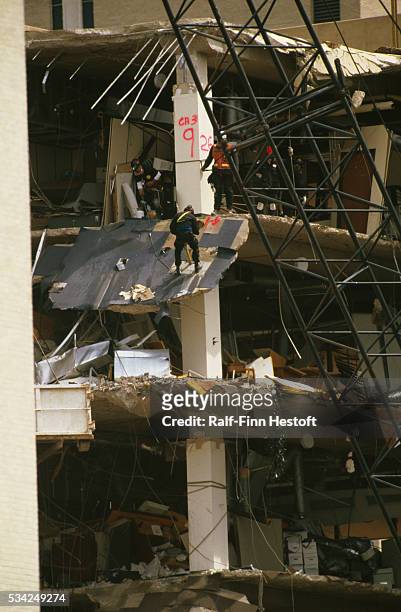 Rescue worker rappels down the side of the destroyed Federal Building in the aftermath of the Oklahoma City bombing. On April 19th a...