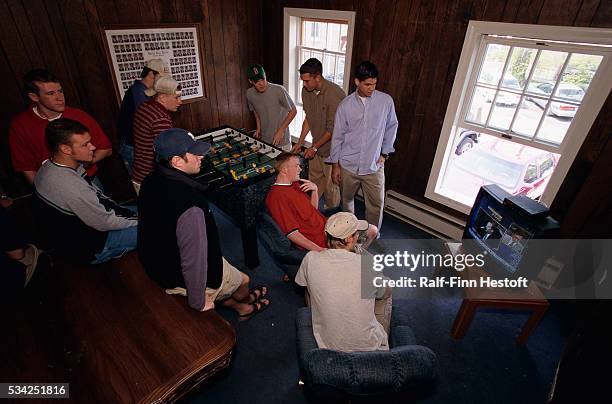 Fraternity brothers at Delta Tau Delta watch CNBC in a recreation room at Miami University in Oxford, Ohio.