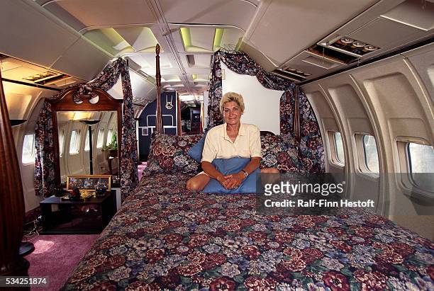 Jo Ann Ussery sits on her bed inside her converted Boeing 727. Rather than buying a mobile home, Ussery purchased an old Boeing 727 for $2,000 USD...