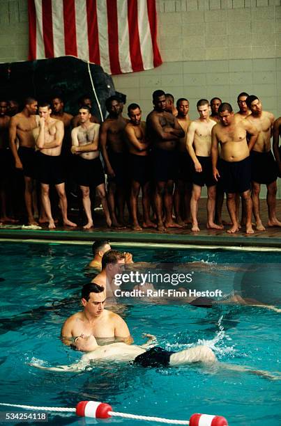 Group of US Navy recruits learns swimming techniques during training at the Great Lakes Naval Training Station in Illinois.