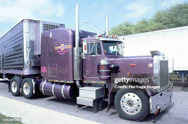 Peterbilt truck showing purple cab, 2000.