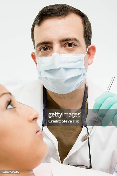 orthodontist with patient - surgical mask profile stock pictures, royalty-free photos & images