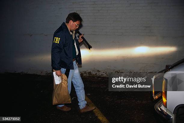 An agent from the FBI searches for evidence near the Oklahoma City bomb site on the day of the attack. On April 19 Timothy McVeigh exploded a truck...