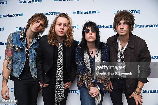 Gethin Davies, Adam Slack, Luke Spiller and Jed Elliott of the band The Struts visit the SiriusXM Studio on May 25, 2016 in New York City.