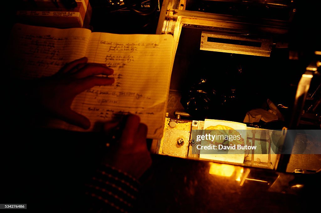 Scientist Writing in Notebook