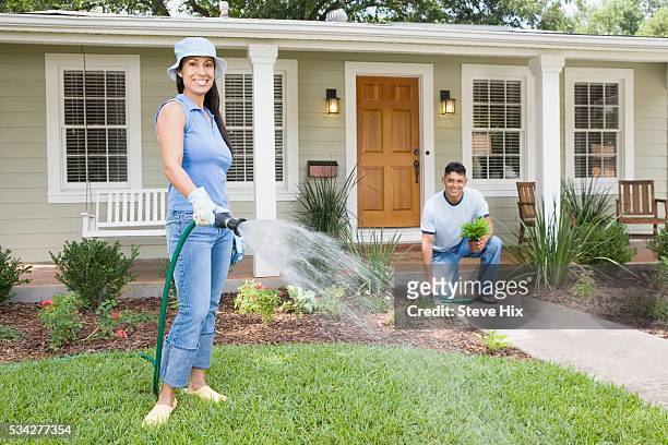couple gardening in front yard - ideal wife bildbanksfoton och bilder