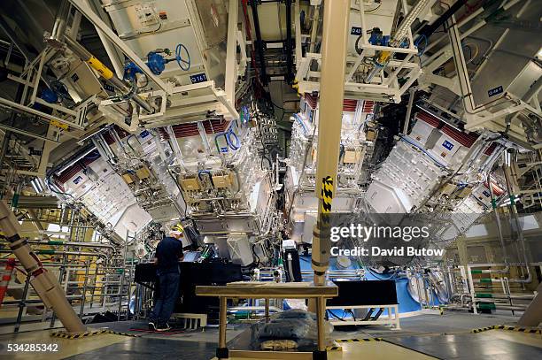 Engineers work outside the structure where the array of lasers at the National Ignition Facility at Lawrence Livermore Laboratory are focused. The...