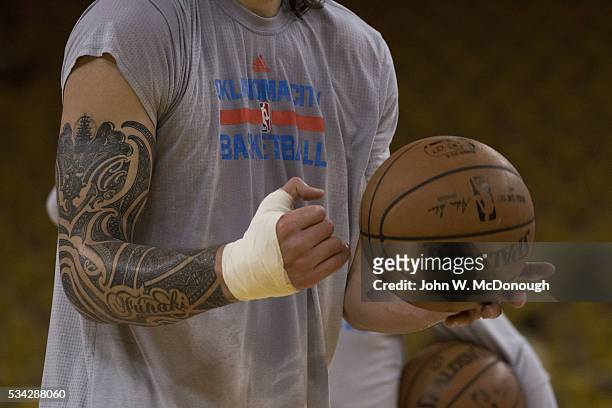 Playoffs: Closeup of Oklahoma City Thunder Steven Adams tattoo on arm during warmups before game vs Golden State Warriors at Oracle Arena. Game 2....