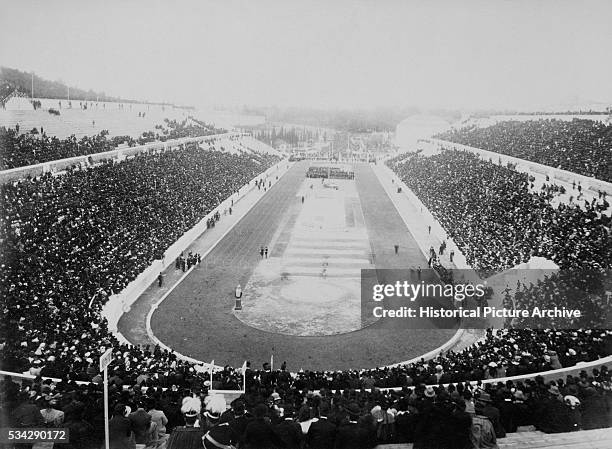 Panaromic view of the 1896 Olympic Games held in a crowd-filled stadium in Athens, Greece.